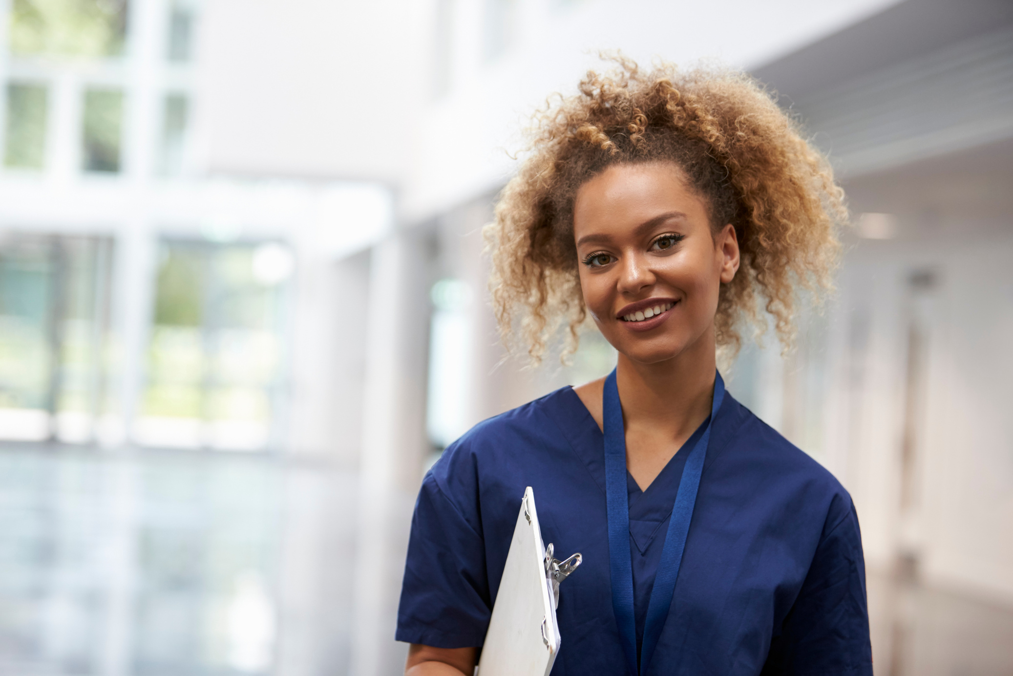 Portrait of Female Nurse Wearing Scrubs in Hospital